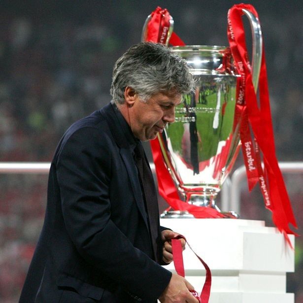 0-ac-milans-coach-carlo-ancelotti-reacts-as-he-passes-the-trophy-after-losing-the-champions-league.jpg